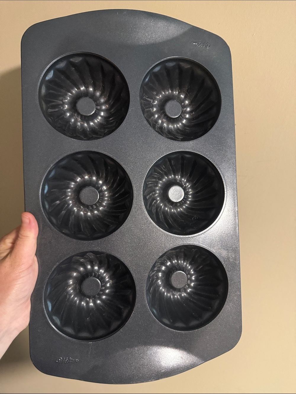 6-cavity non-stick mini fluted tube cake or bundt pan.